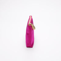Side view of Hot pink satin pouch.