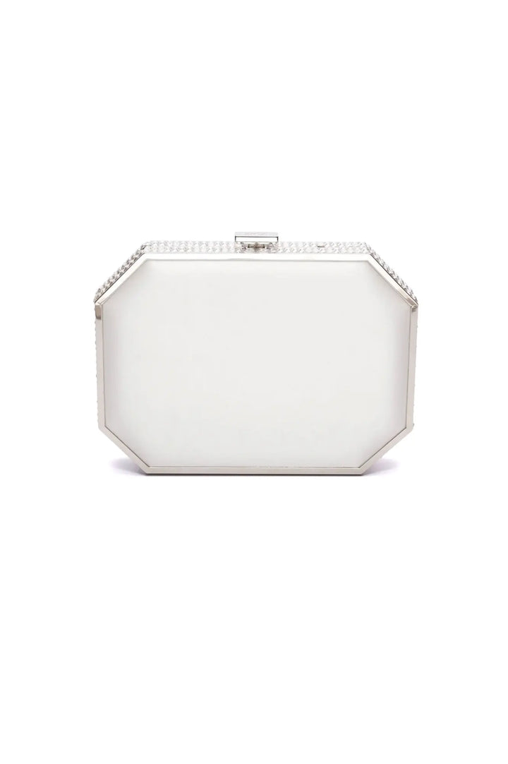 White satin hexagonal Como Clutch x MICAELA purse with rhinestone detailing by The Bella Rosa Collection.