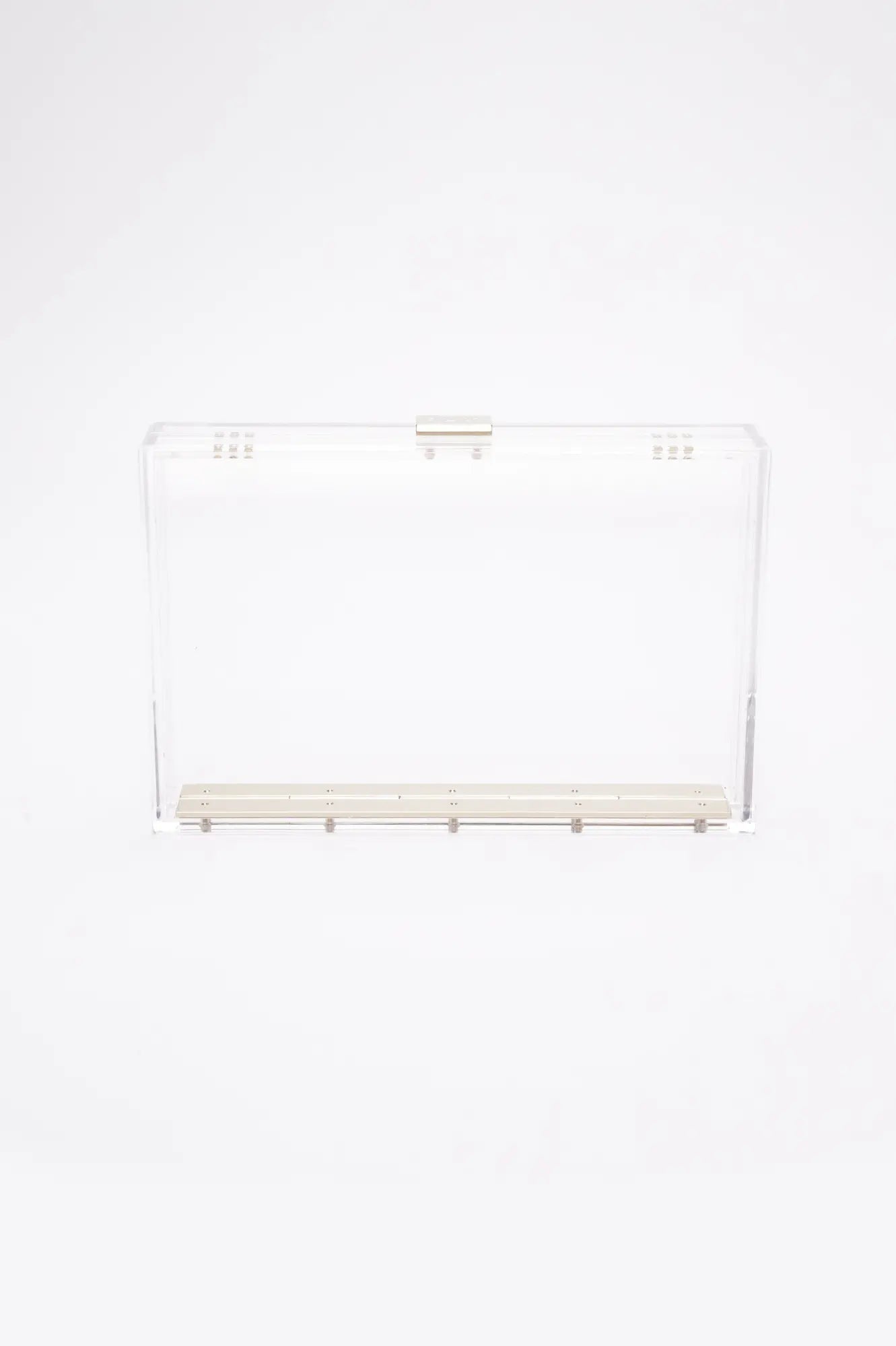 Introducing the Mia Acrylic Clutch from The Bella Rosa Collection: a transparent, acrylic rectangular box clutch featuring a floral satin zipper pouch inside and metallic latch and hinge, set against a plain white background.