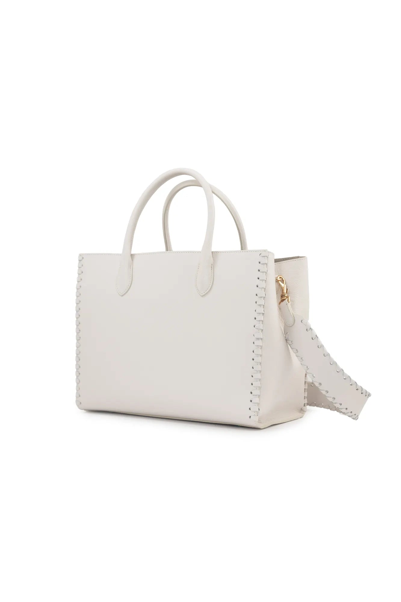 The LOVE Tote - White from The Bella Rosa Collection features a pristine leather finish with double handles, a stitched trim, and a detachable strap. Its elegant design makes it the perfect versatile bag for any occasion, easily transitioning from casual outings to special events against a plain background.