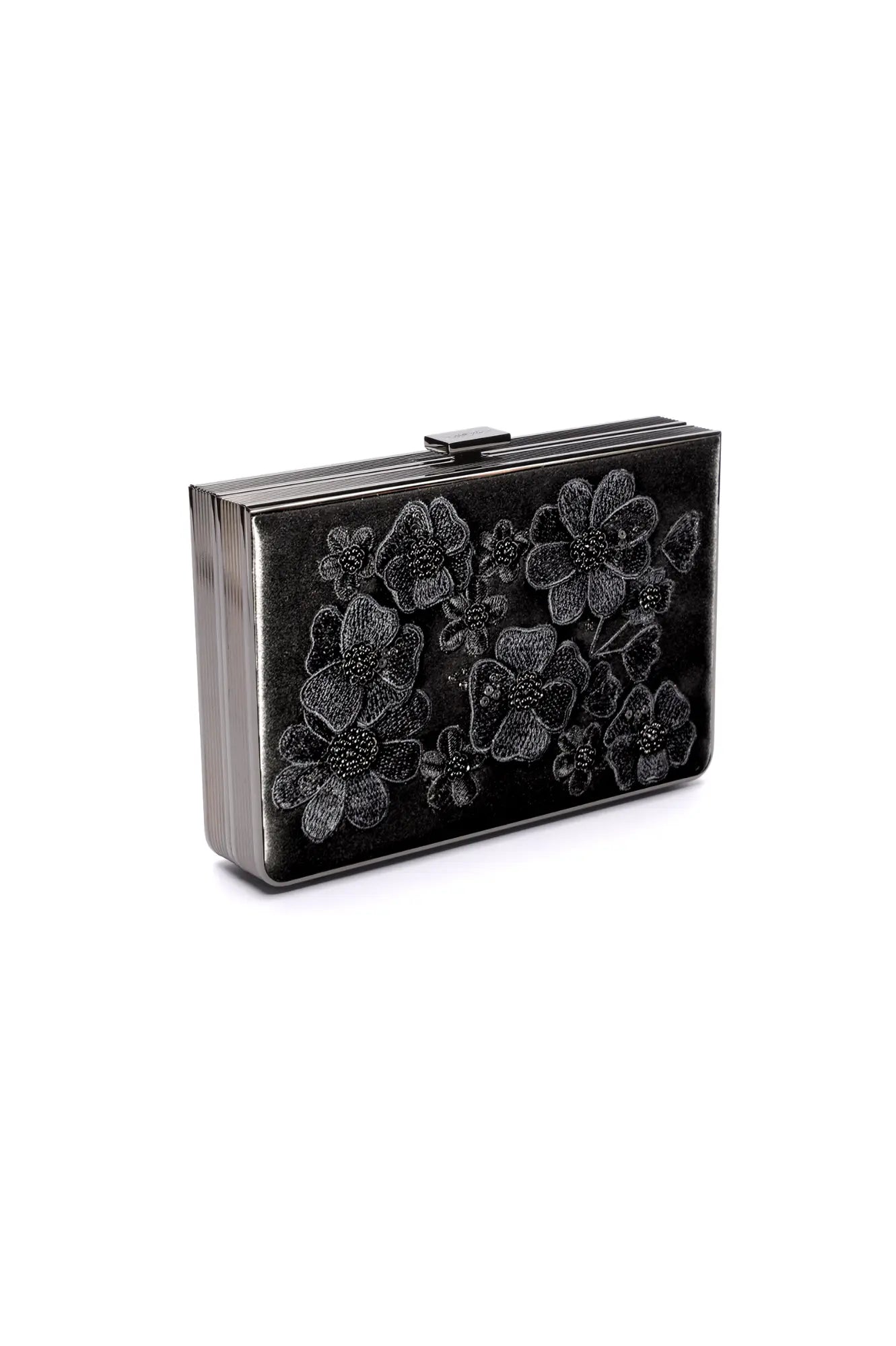 The Venezia Clutch x MICAELA from The Bella Rosa Collection is a black satin rectangular clutch bag embellished with 3D floral embroidery and an embossed floral design, currently part of a sample sale.