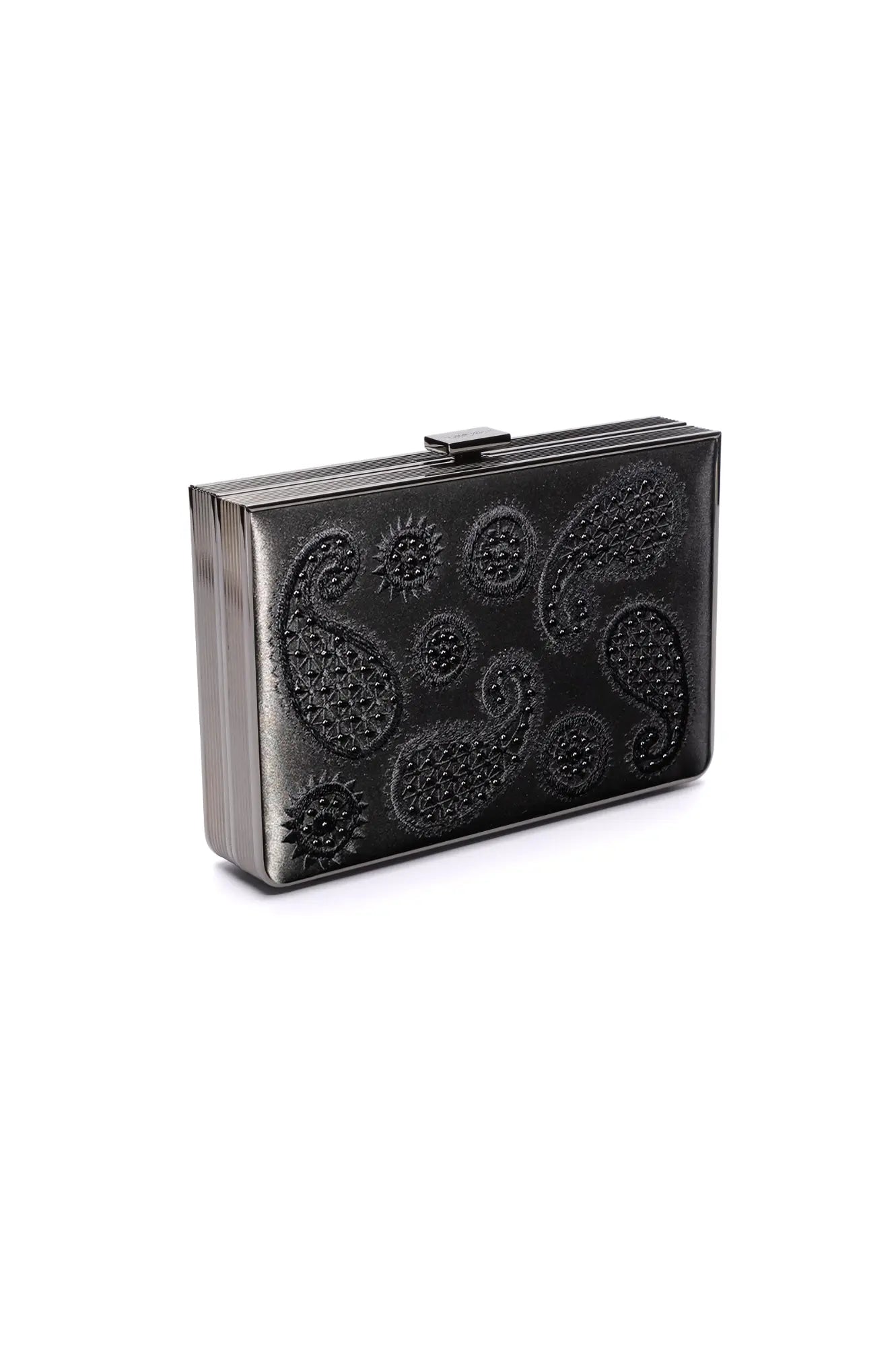 The Bella Rosa Collection presents the Venezia Clutch x MICAELA, a stunning black satin clutch adorned with intricate 3D paisley embroidery. This sleek rectangular purse is both stylish and eye-catching, and is available as a sample sale item.