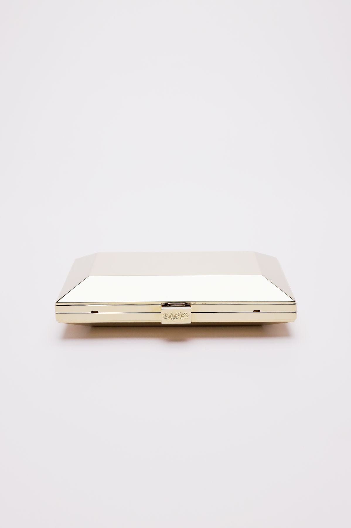 Top closed view of Milan geometric clutch in gold.