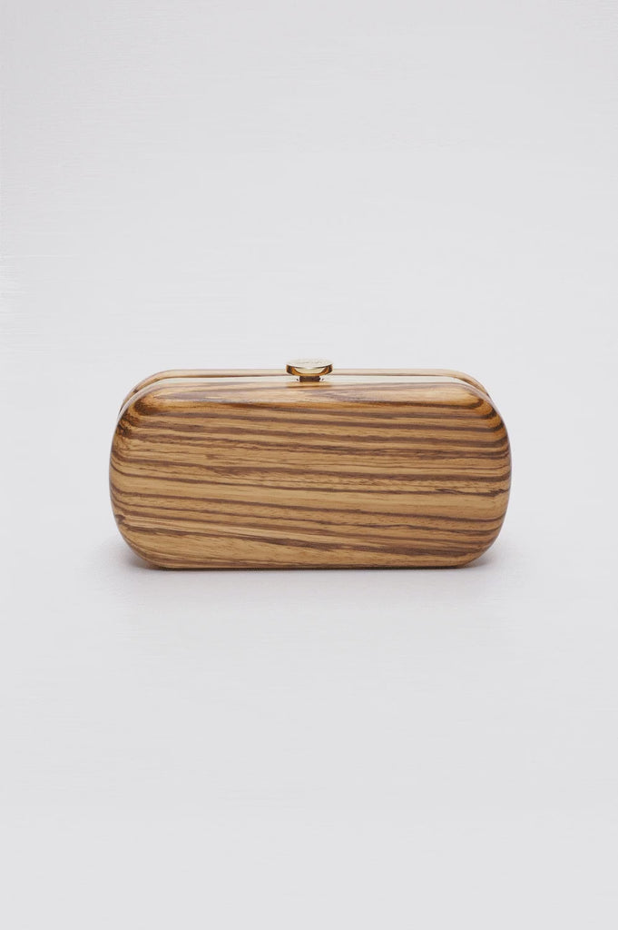 360 View of Bella Clutch with a gold hardware frame in a solid African Zebra Wood Body.
