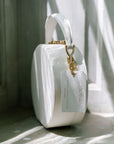 The Original Hat Box Handbag by Joy Proctor and Bella Rosa in White Pebble Leather with Gold Accents.  Edit alt text
