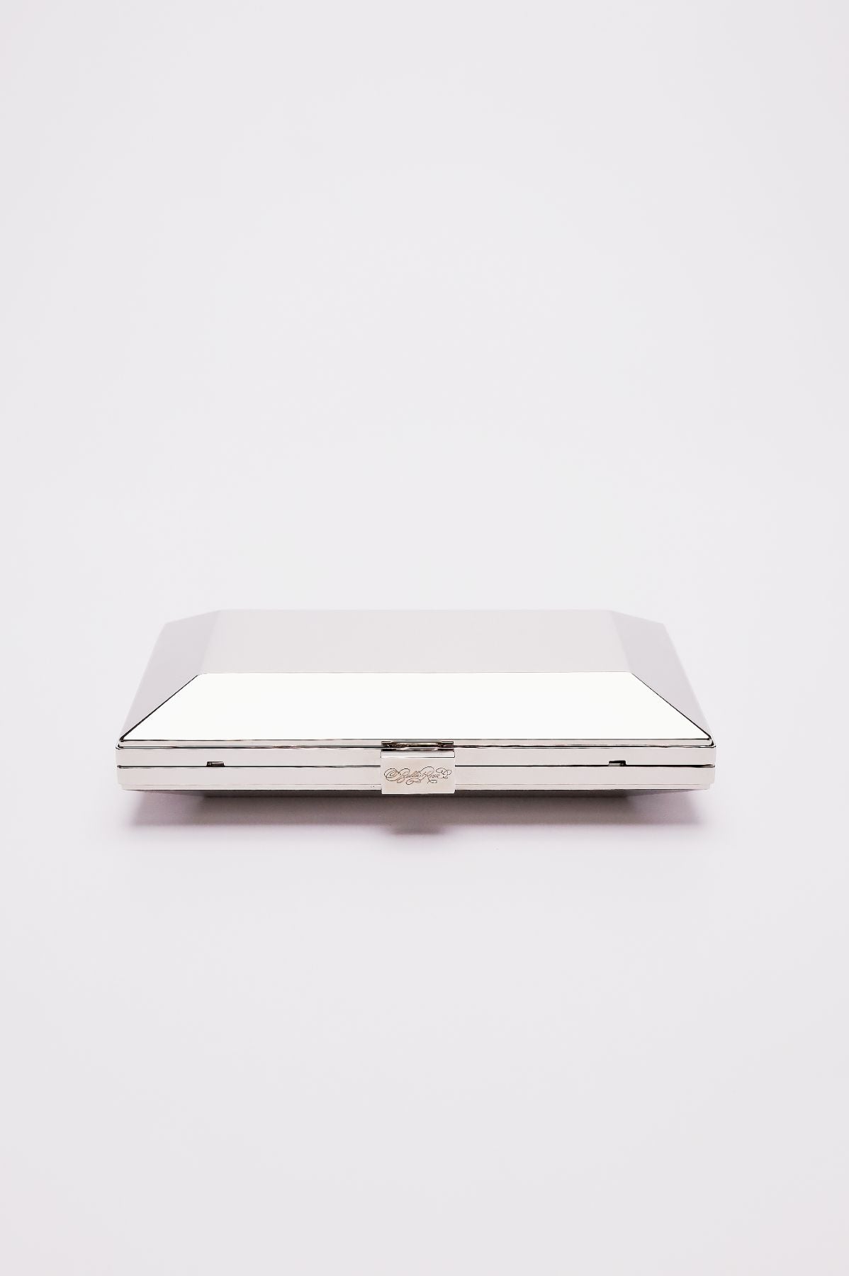 Top closed view of Milan geometric clutch in silver.