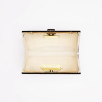 A Milan Clutch x MICAELA - Hot Pink Metallic by The Bella Rosa Collection on a white background.