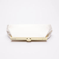 Top view of a white bridal clutch.