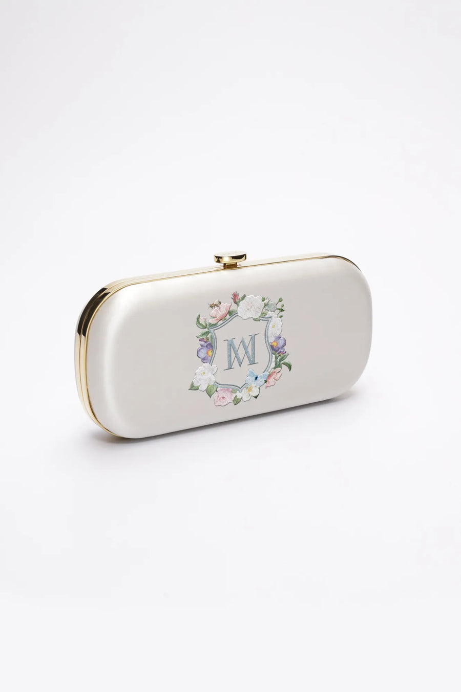 A Ivory Satin Bella Clutch - Monogram Floral Crest purse from The Bella Rosa Collection.