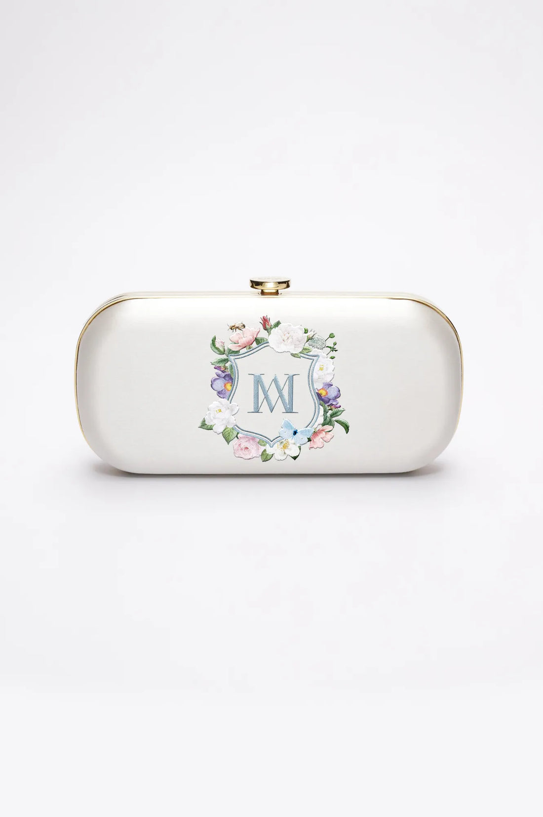 A Ivory Satin Bella Clutch - Monogram Floral Crest from The Bella Rosa Collection.