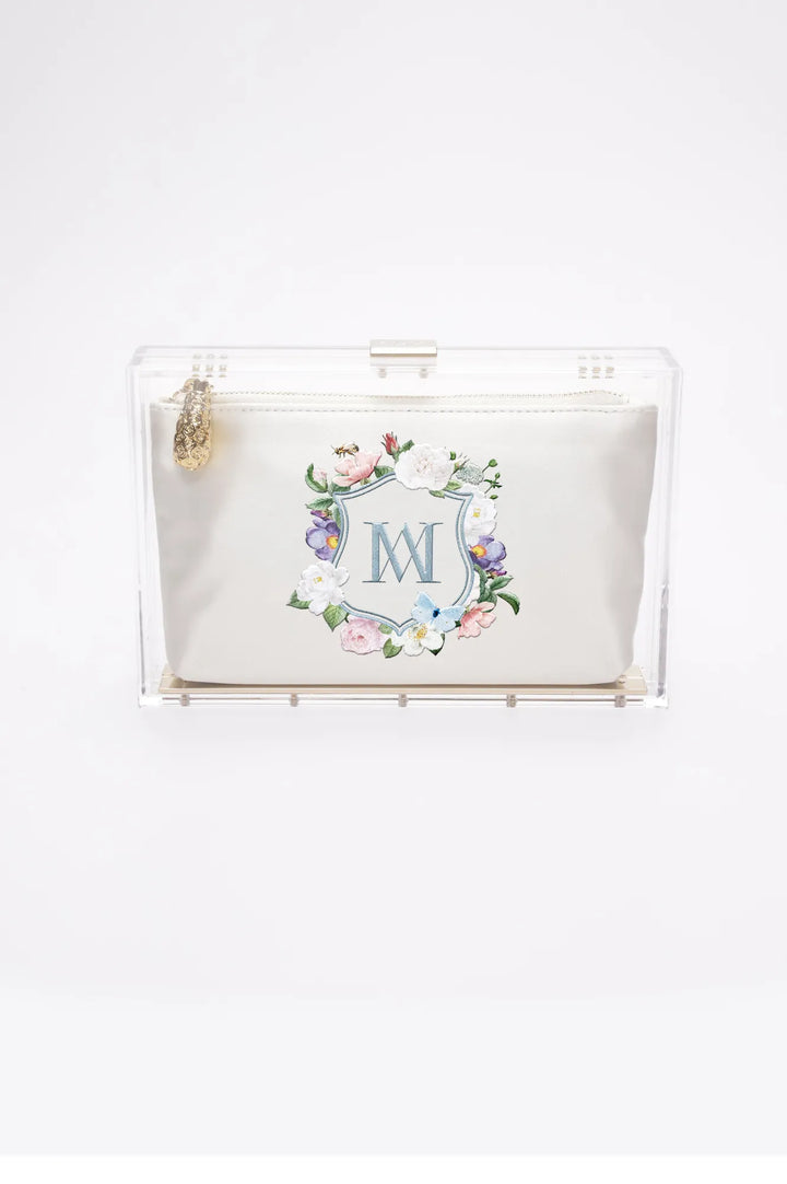 A Mia - Clear Acrylic Clutch with Floral Monogram Embroidery from The Bella Rosa Collection.