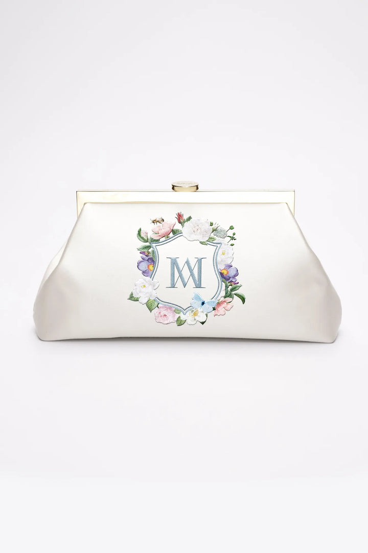 A Bella Rosa Collection Rosa Clutch - Ivory Floral Embroidery with a monogrammed de