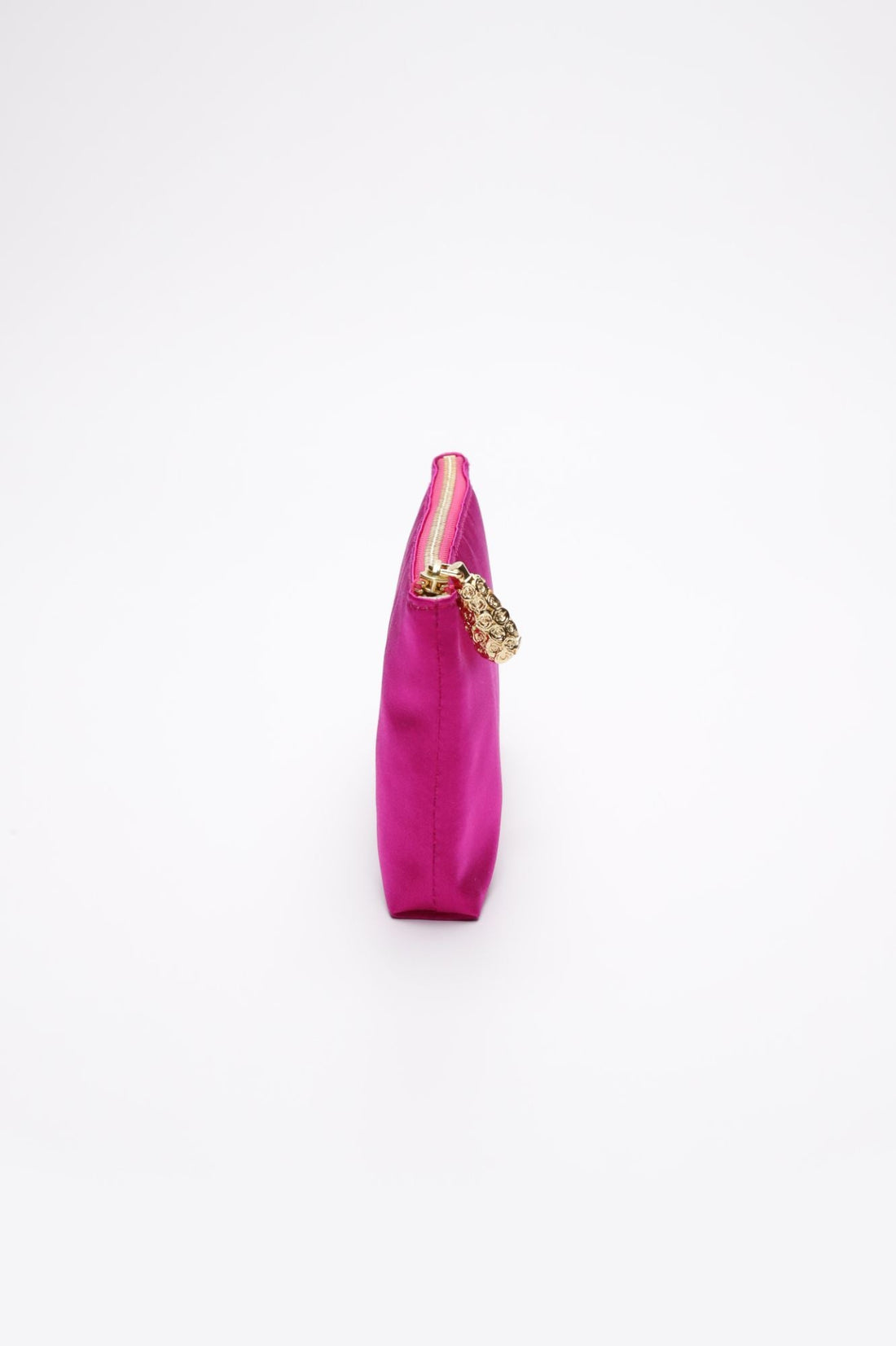 Side view of Hot pink satin pouch.