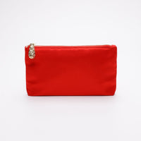 Red satin pouch with gold zipper.