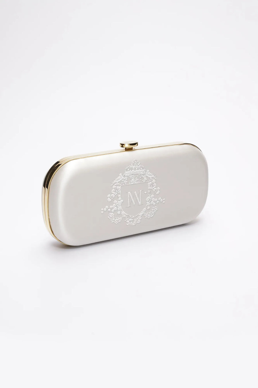 Side view of ivory satin Bella bridal clutch with gold hardware and white bridal monogram embroidery.