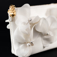 An Hayden Clutch Purse from The Bella Rosa Collection with organza flowers.