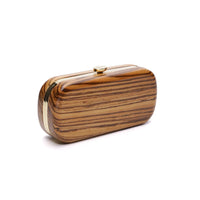 A sustainably sourced Bella Clutch African Zebra Wood Petite with a gold clasp on a white background by The Bella Rosa Collection.