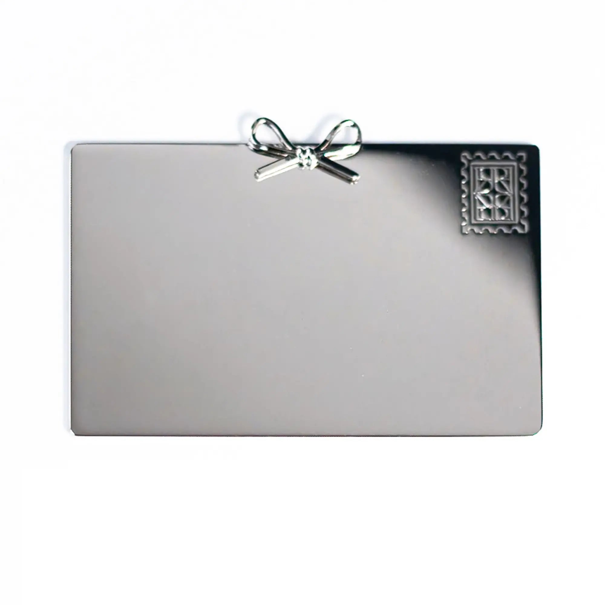 Blank silver gift card with a decorative bow on a white background, featuring a Personalized Plaque Sentiment Engraving from The Bella Rosa Collection.