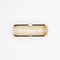 Top open view of Bella Clutch in Ivory white satin with gold hardware frame.