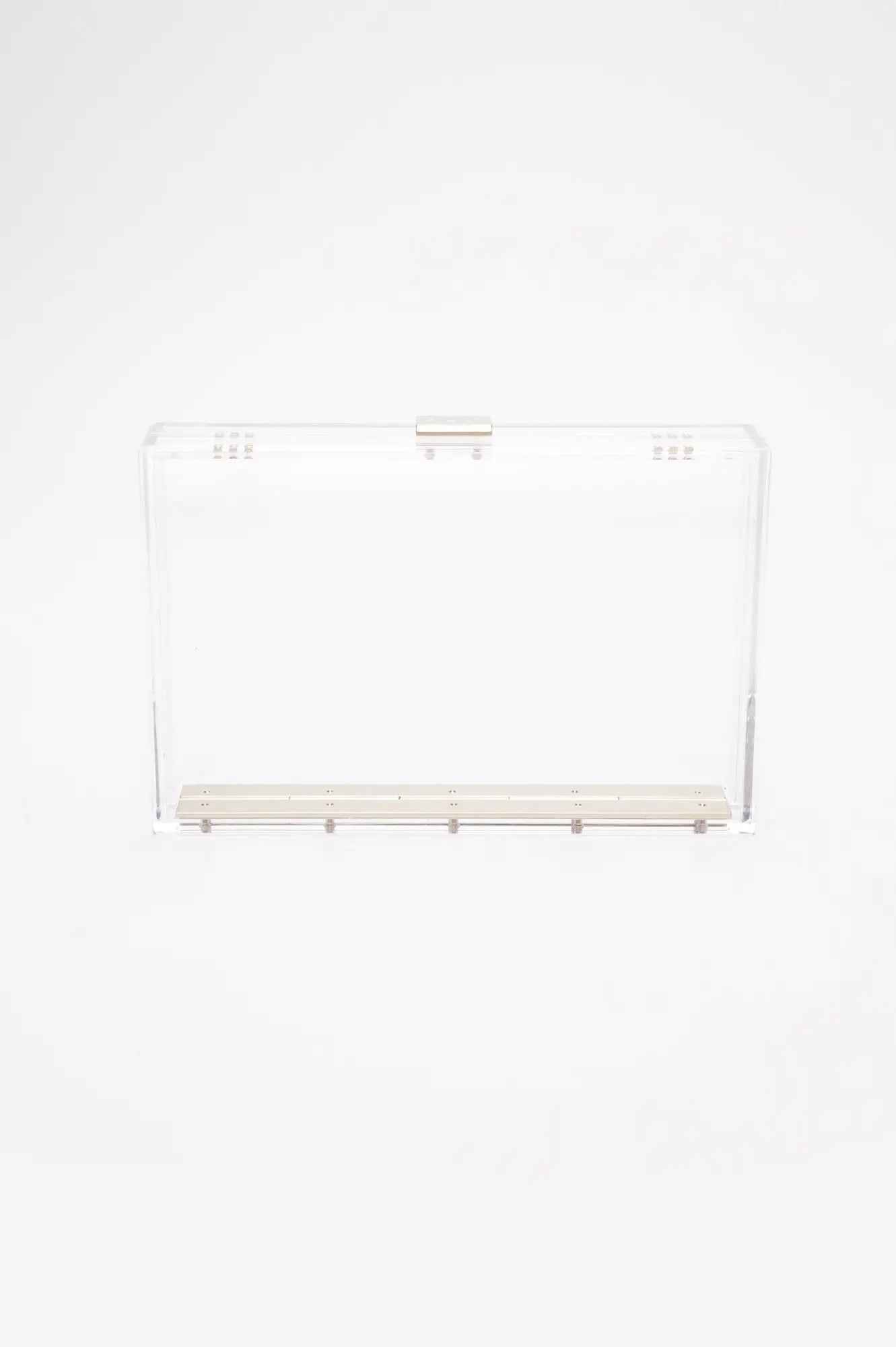 Transparent Italian acrylic Mia Acrylic Clutch with Ivory Satin Zipper Pouch with a hinged lid on a white background by The Bella Rosa Collection.