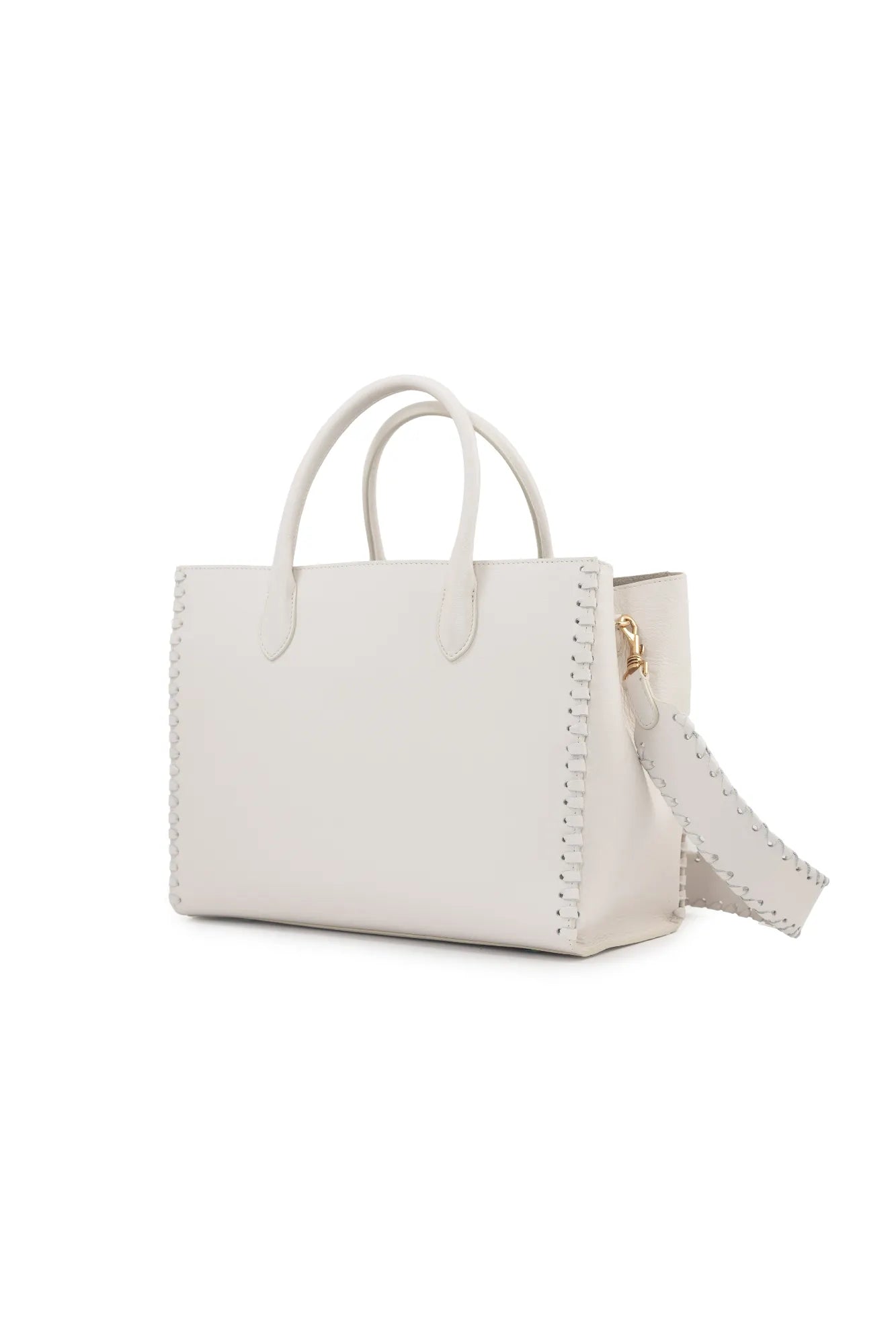 The LOVE Tote - White from The Bella Rosa Collection features a pristine leather finish with double handles, a stitched trim, and a detachable strap. Its elegant design makes it the perfect versatile bag for any occasion, easily transitioning from casual outings to special events against a plain background.