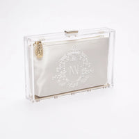 Mia clutch side view with bridal crest monogram embroidery.