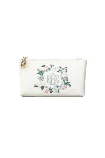White personalized floral bridal crest clutch with gold zipper.
Product Name: The Bella Rosa Collection Hayden Belgian Linen Zipper Pouch with Floral Crest Monogram Embroidery.