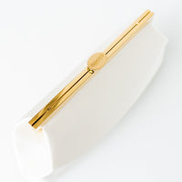 Top view of Rosa Clutch in Ivory white satin with gold hardware clasp frame.