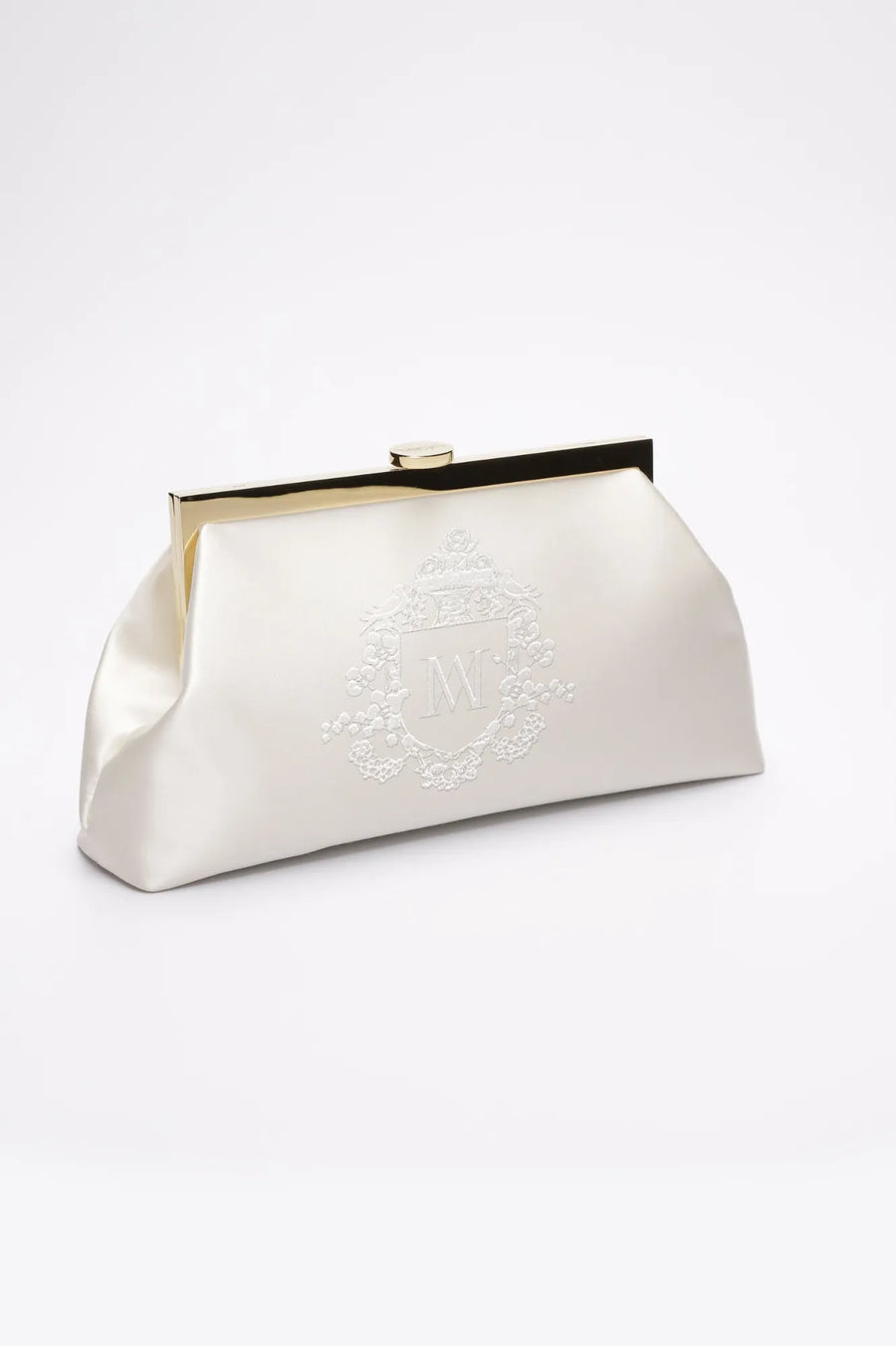 Side angle of a white bridal clutch with Whyte bridal wedding crest, monogram embroidery.