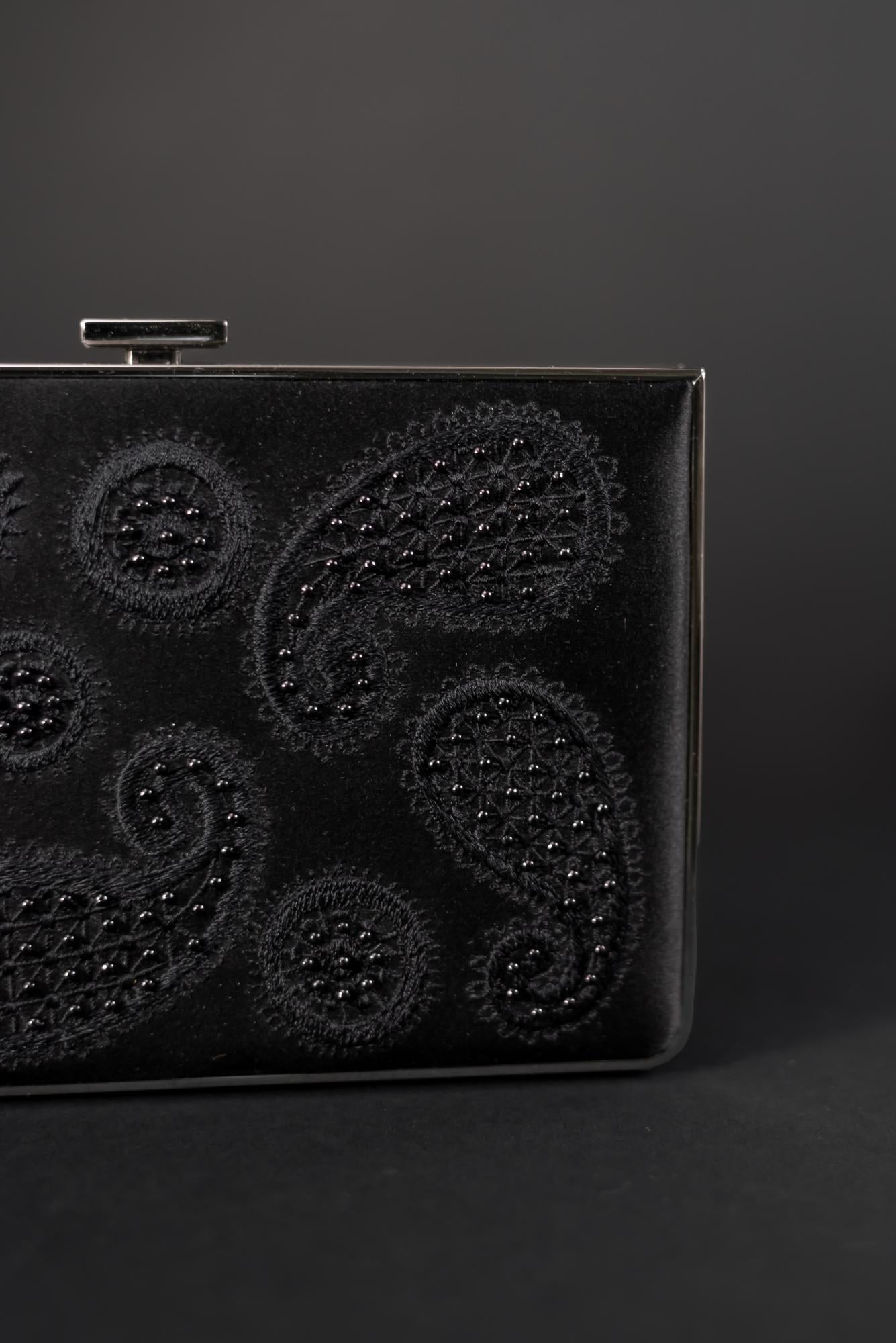 A black purse with a paisley design from The Bella Rosa Collection.