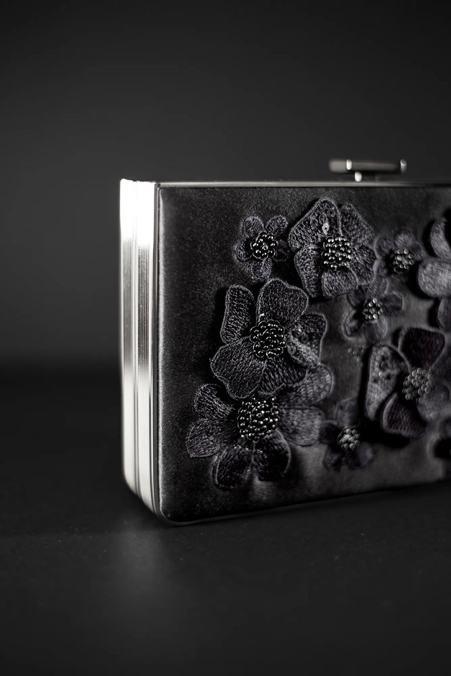 An exclusive The Bella Rosa Collection Venezia Clutch x MICAELA - Black Satin Floral Embroidery with 3D floral embroidery.