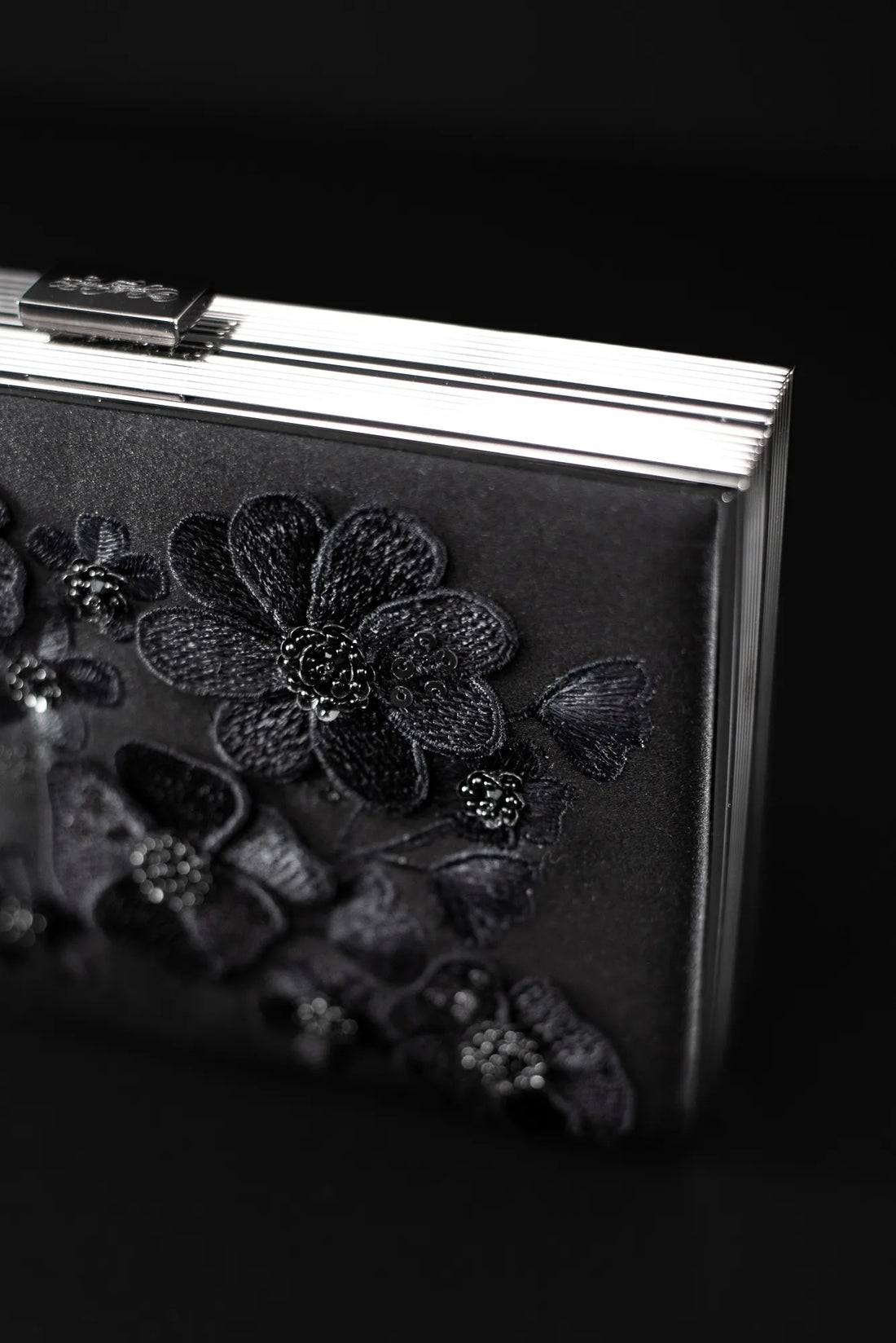 An exclusive capsule collection Venezia Clutch x MICAELA - Black Satin Floral Embroidery with 3D floral embroidery from The Bella Rosa Collection.