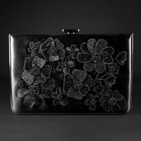 An exclusive Venezia Clutch x MICAELA - Black Satin Floral Embroidery from The Bella Rosa Collection featuring 3D floral embroidery.