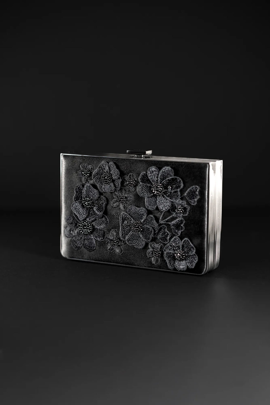 An exclusive Venezia Clutch x MICAELA - Black Satin Floral Embroidery from The Bella Rosa Collection adorned with exquisite 3D Floral Embroidery.