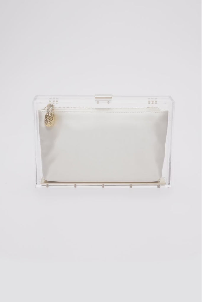 360 view of the clear acrylic Mia body with white satin pouch.