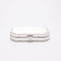 Top closed view of Como clutch in white satin with silver gemmed frame.