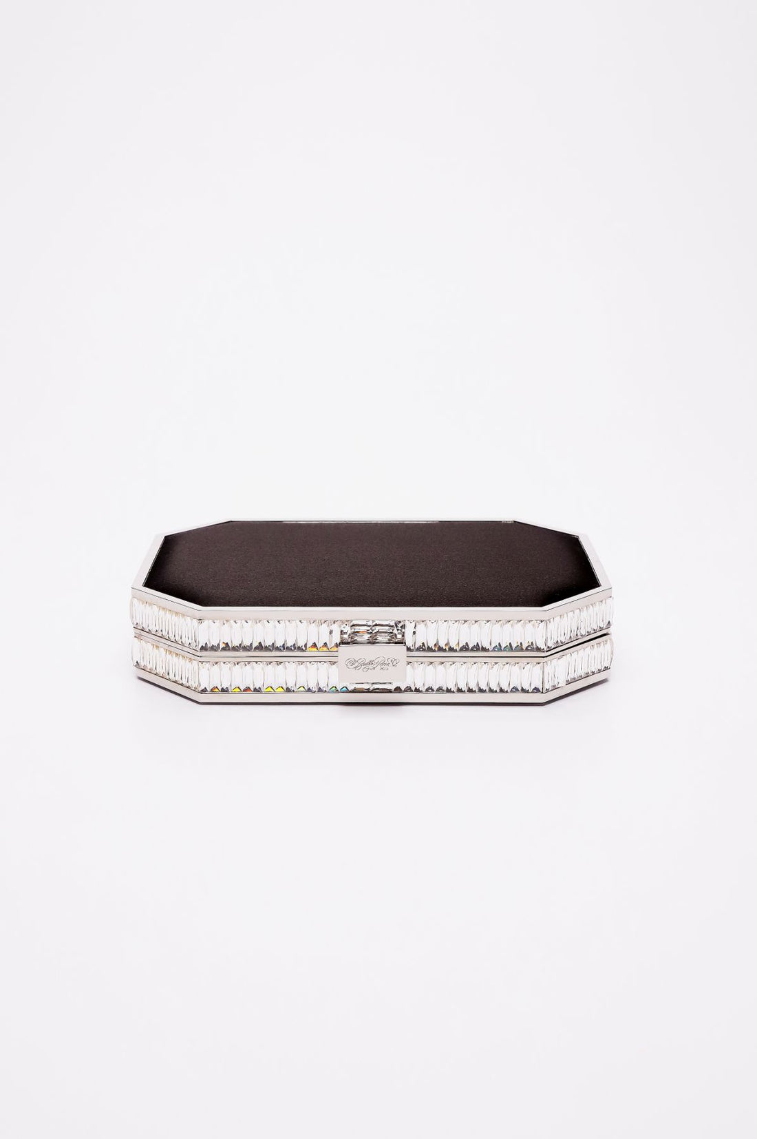 Top closed view of Como Clutch with a octagon silhouette in black satin and silver gemmed frame.