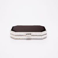 Top closed view of Como Clutch with a octagon silhouette in black satin and silver gemmed frame.
