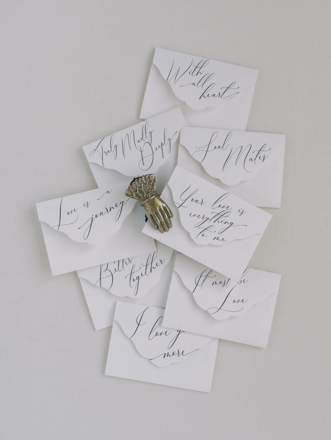 A group of Wedding Day Love Note Box Stationery Set with calligraphy on them, from The Bella Rosa Collection.