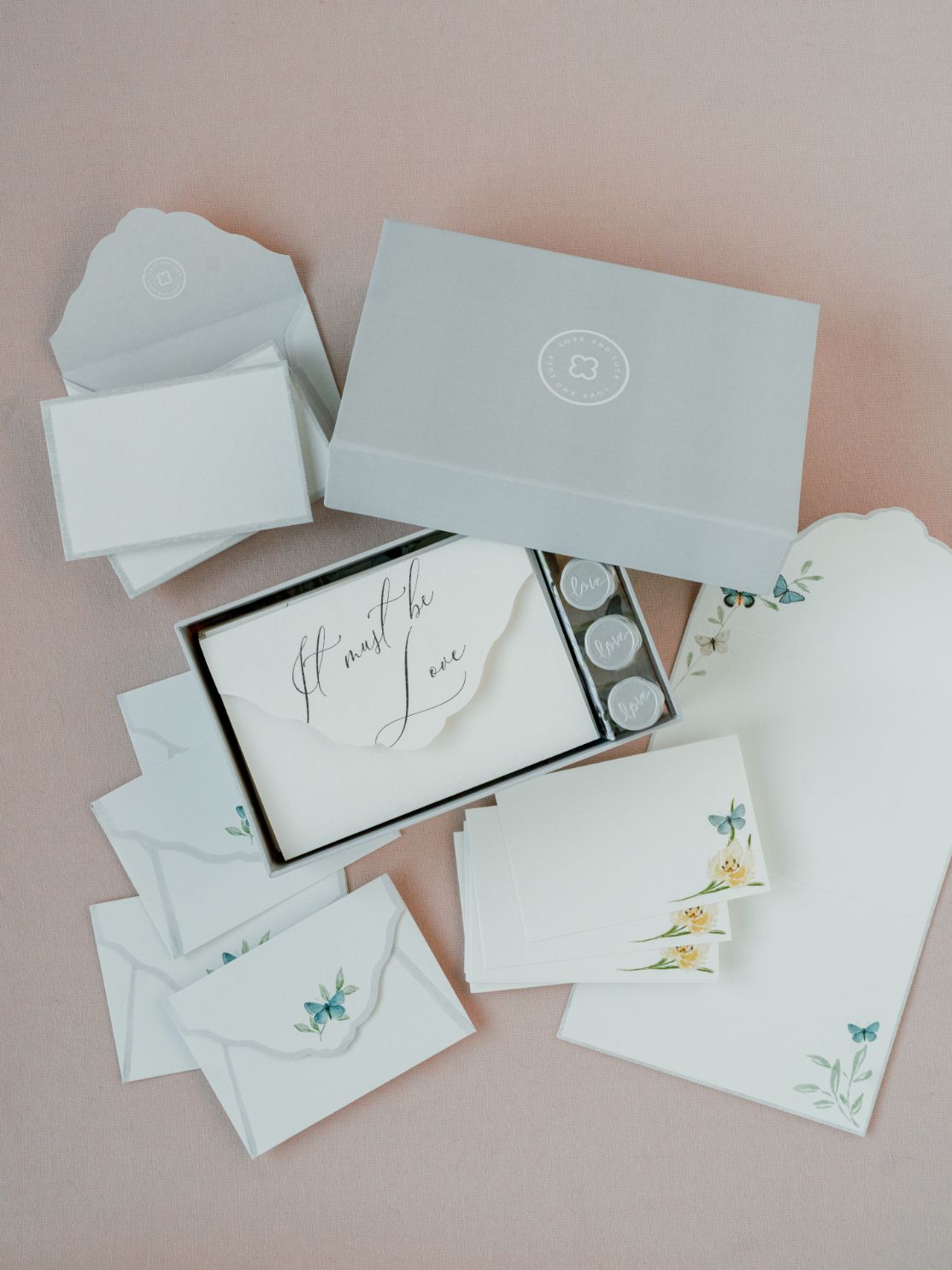 A Wedding Day Love Note Box Stationery Set from The Bella Rosa Collection featuring watercolor floral motif vow note cards and envelopes.