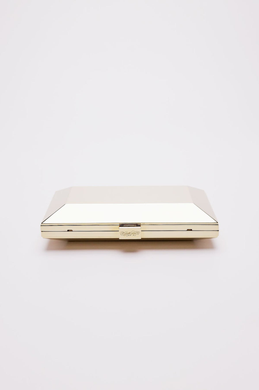 Top closed view of Milan geometric clutch in gold.