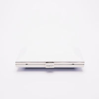Top closed view of Milan Clutch in pearl white with silver hardware frame.