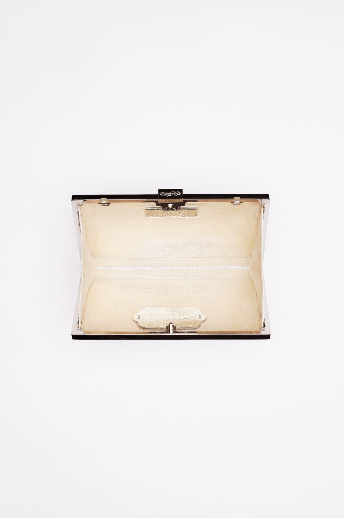 Top open view of Milan Clutch in pearl white with silver hardware frame.