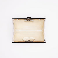 Top open view of Milan Clutch in pearl white with silver hardware frame.