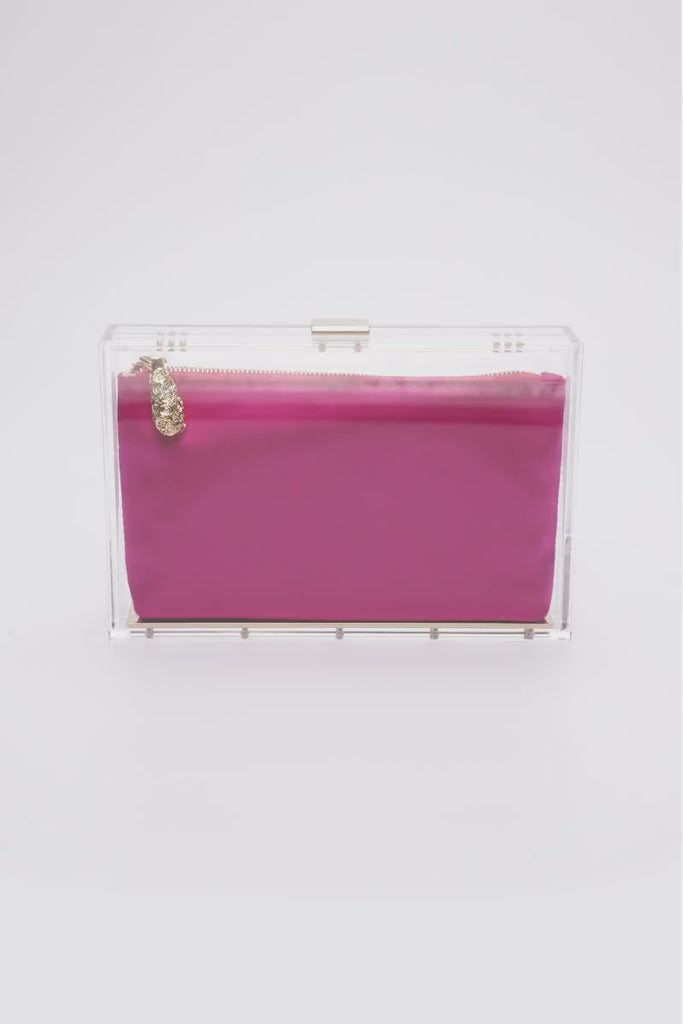 360 view of the Mia Clutch with clear acrylic rectangle body with a hot pink satin interior pouch.