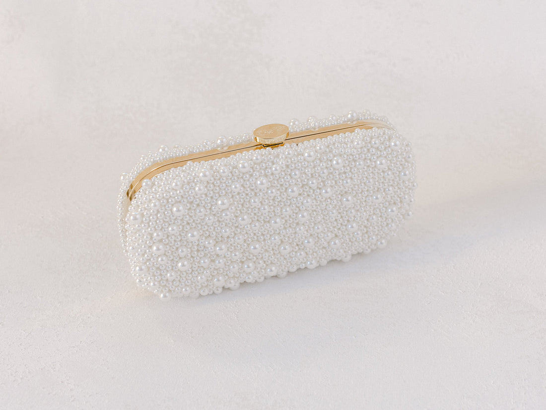 An Over the Moon True Love Bella Pearl Clutch on a white background.