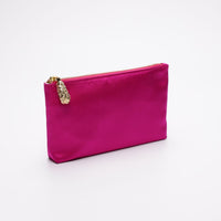 Side angle view of Hot pink satin pouch.