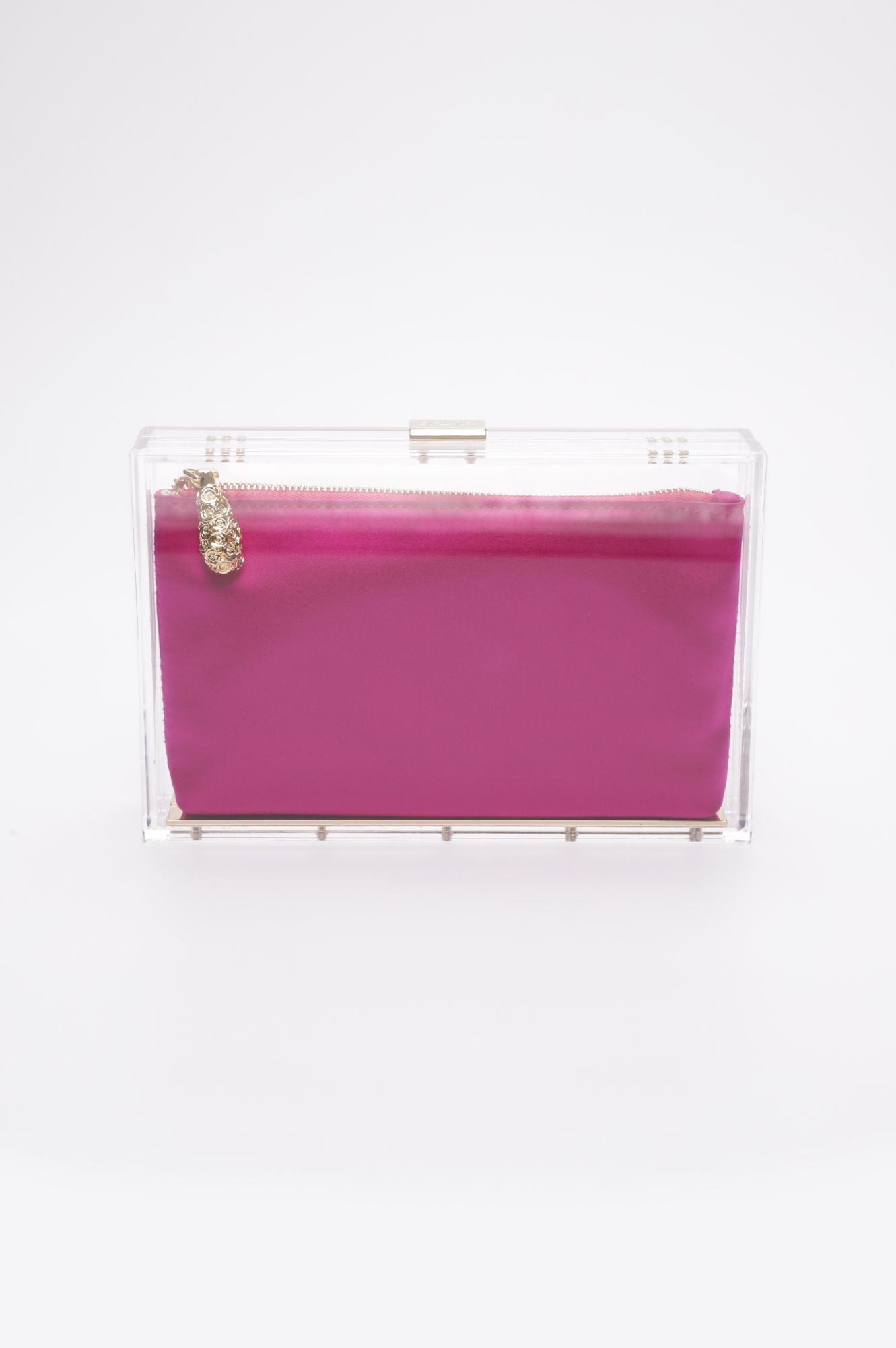 A Mia Clutch from The Bella Rosa Collection, featuring a hot pink satin zipper pouch housed in a clear acrylic rectangular box, is displayed against a plain white background. Don't miss out on this item from our sample sale!