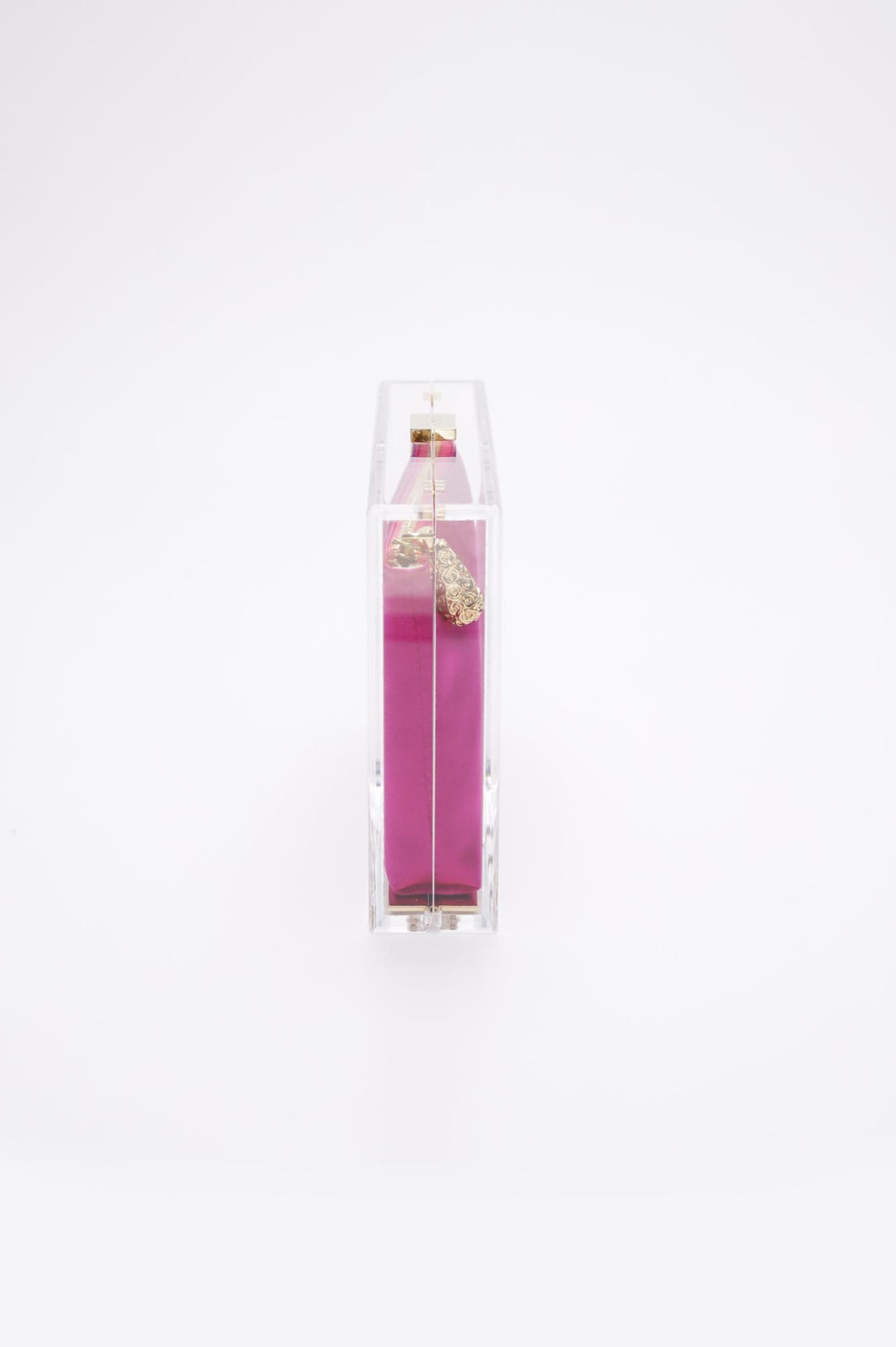 Side view of the  Mia Clutch with clear acrylic rectangle body with a hot pink satin interior pouch.
