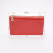 The Mia Clutch what a clear acrylic rectangle hard case with an interior red satin pouch.